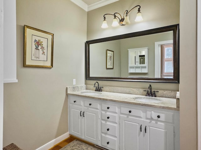 bathroom with hardwood / wood-style floors, vanity, and crown molding