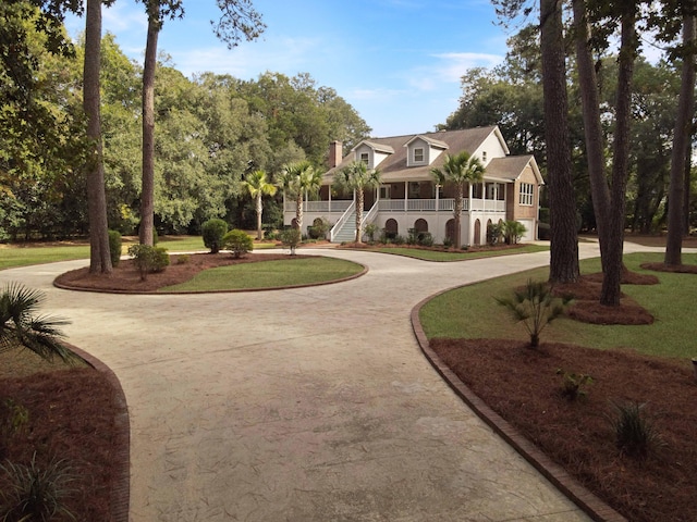 view of property's community with a lawn