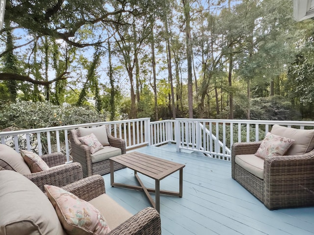 wooden deck with an outdoor living space