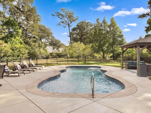 view of swimming pool with a gazebo, outdoor lounge area, and a patio