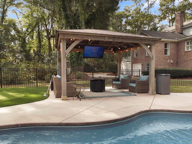 view of swimming pool with an outdoor living space, a gazebo, and a patio