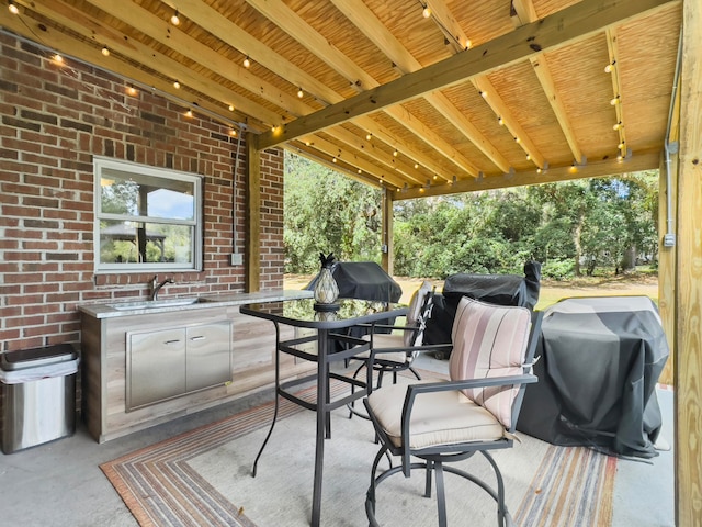 view of patio featuring sink and area for grilling