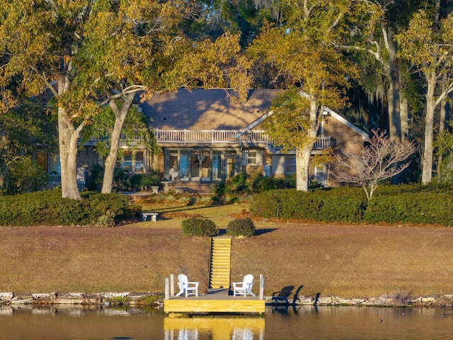 back of house featuring a water view