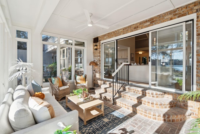 sunroom / solarium with ceiling fan