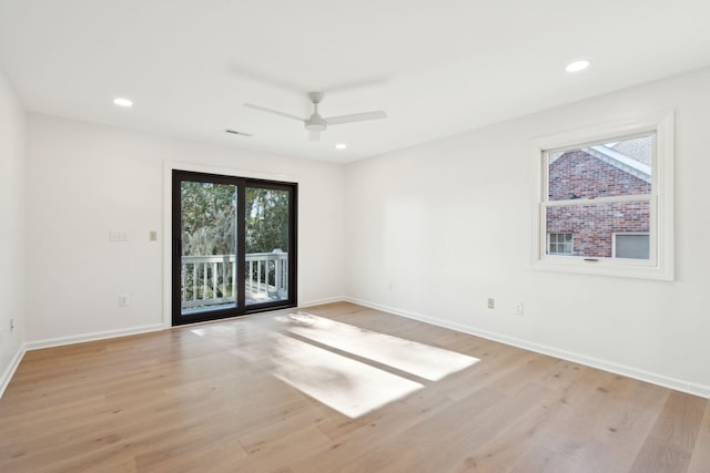 spare room with ceiling fan and light hardwood / wood-style flooring