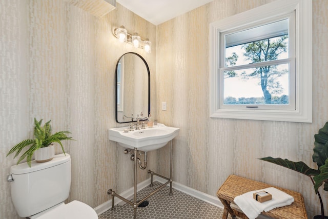 bathroom with sink, tile patterned flooring, and toilet