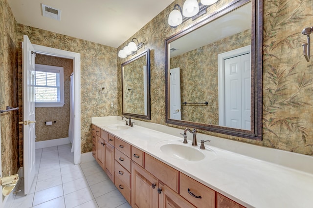 bathroom with tile patterned floors and vanity