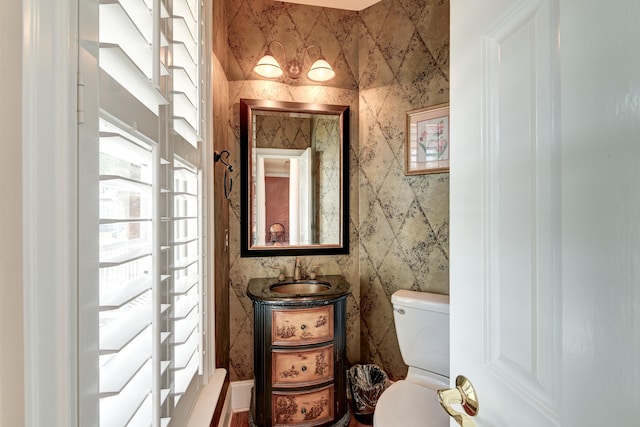 bathroom with vanity and toilet