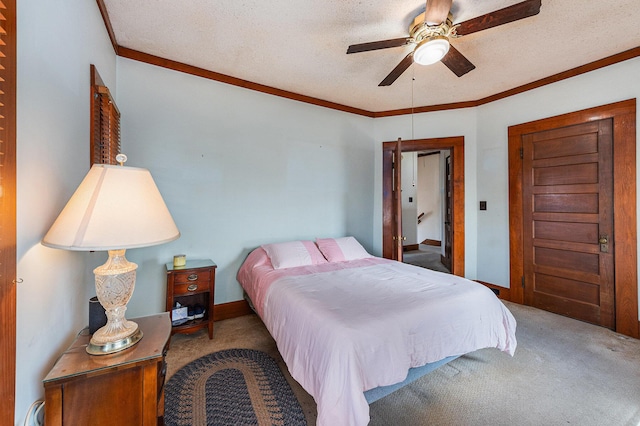 bedroom featuring a textured ceiling, baseboards, crown molding, and carpet flooring