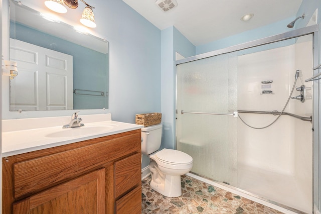 full bathroom with toilet, vanity, a shower stall, and visible vents