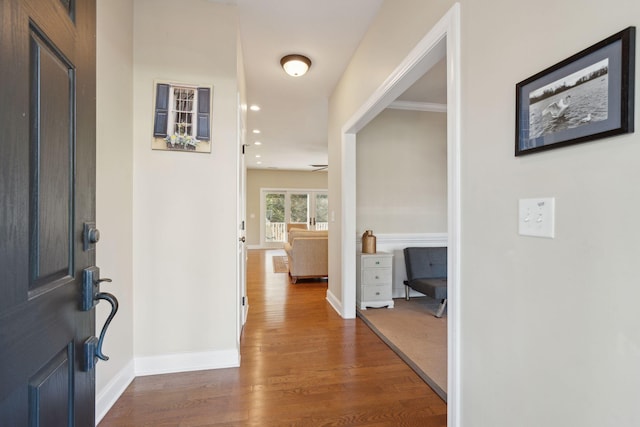 foyer entrance with recessed lighting, wood finished floors, and baseboards