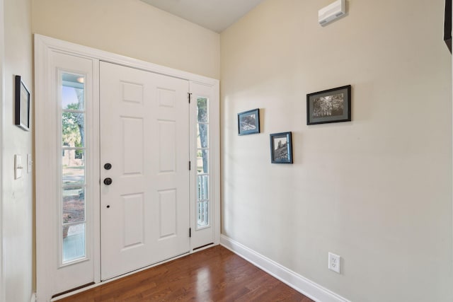 entryway with baseboards, dark wood finished floors, and a wealth of natural light