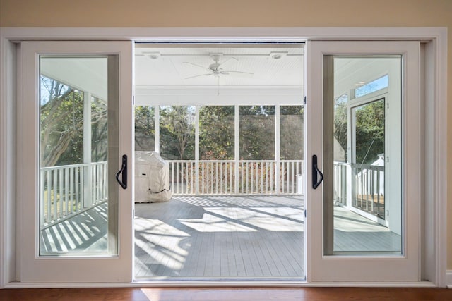 entryway with a ceiling fan and wood finished floors