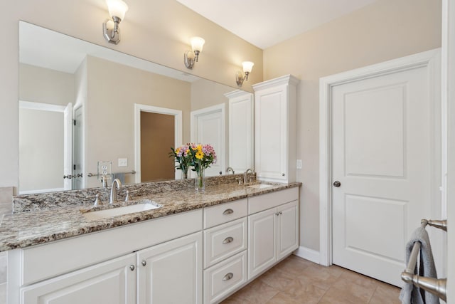 bathroom with double vanity and a sink