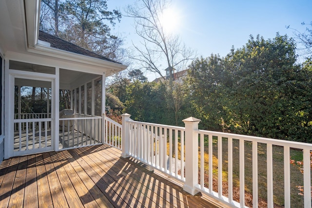 wooden deck featuring a sunroom