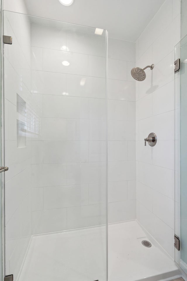 bathroom featuring a shower stall