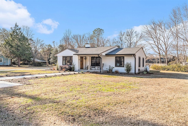 view of front of property with a porch and a front yard