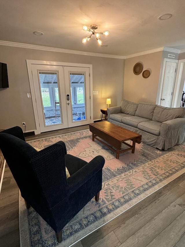 living area featuring crown molding, baseboards, wood finished floors, and french doors