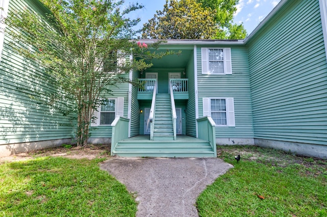 6280 Rolling Fork Rd Unit 302, North Charleston, SC 29406 - property entrance featuring a lawn and a balcony