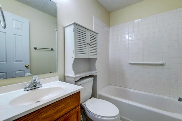 6280 Rolling Fork Rd Unit 302, North Charleston, SC 29406 - bathroom featuring vanity, a textured ceiling, and bathtub / shower combination