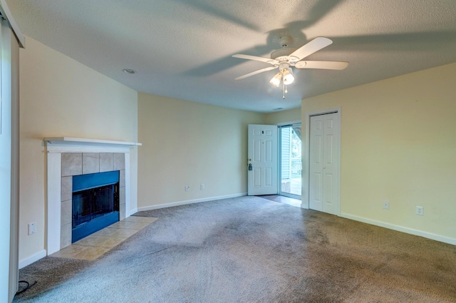 6280 Rolling Fork Rd Unit 302, North Charleston, SC 29406 - unfurnished living room featuring carpet flooring, a ceiling fan, a fireplace, and a textured ceiling