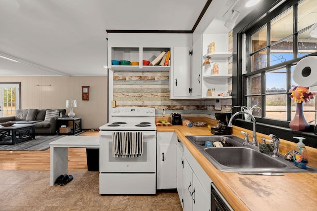 kitchen featuring wood counters, white cabinetry, sink, ornamental molding, and electric stove