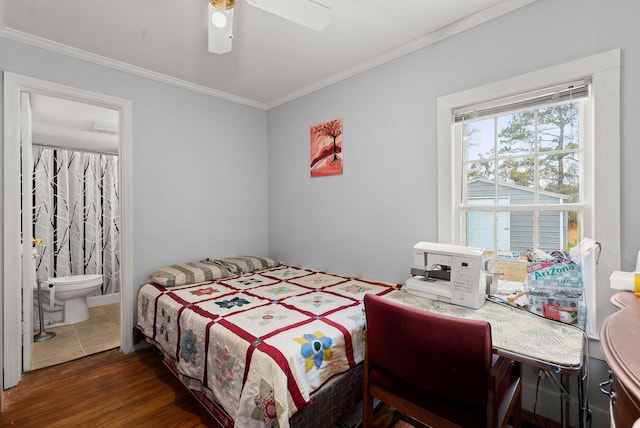 bedroom featuring ensuite bathroom, dark hardwood / wood-style flooring, crown molding, and ceiling fan