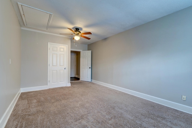 spare room featuring ceiling fan, a textured ceiling, and carpet floors