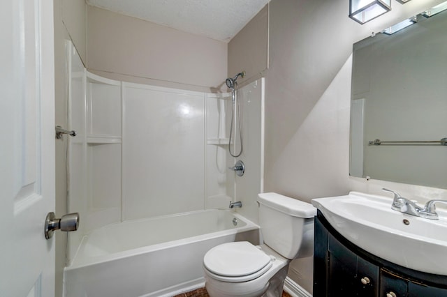 full bathroom featuring vanity, a textured ceiling, toilet, and shower / washtub combination