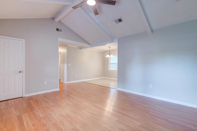 empty room featuring light wood-type flooring, vaulted ceiling with beams, and ceiling fan with notable chandelier