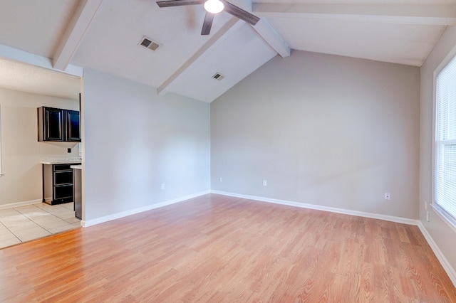 unfurnished living room with lofted ceiling with beams, light hardwood / wood-style floors, and ceiling fan