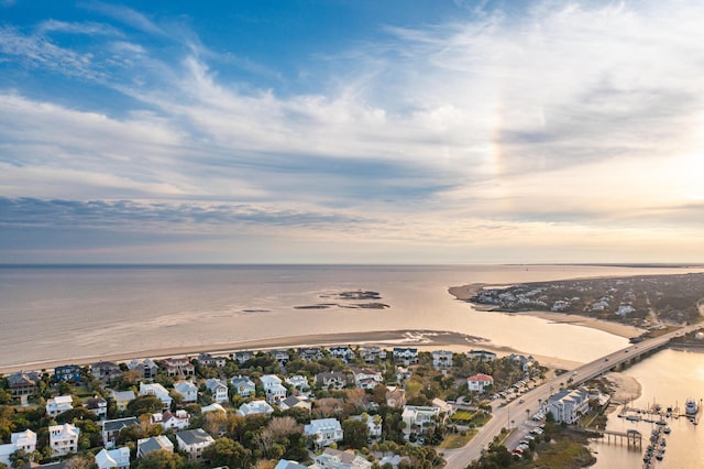 aerial view at dusk with a water view