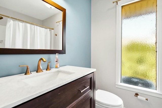 818 Club Cottage Ct, Edisto Beach, SC 29438 - full bathroom featuring vanity, toilet, plenty of natural light, and a shower with curtain