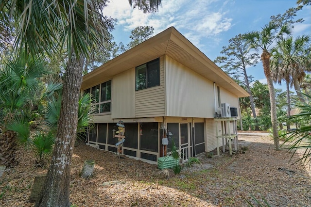 818 Club Cottage Ct, Edisto Beach, SC 29438 - view of side of property featuring a sunroom