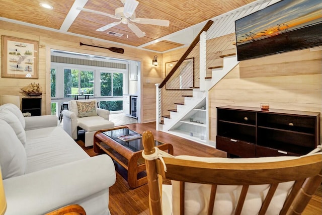 818 Club Cottage Ct, Edisto Beach, SC 29438 - living room featuring wood walls, wooden ceiling, wood finished floors, stairs, and a ceiling fan