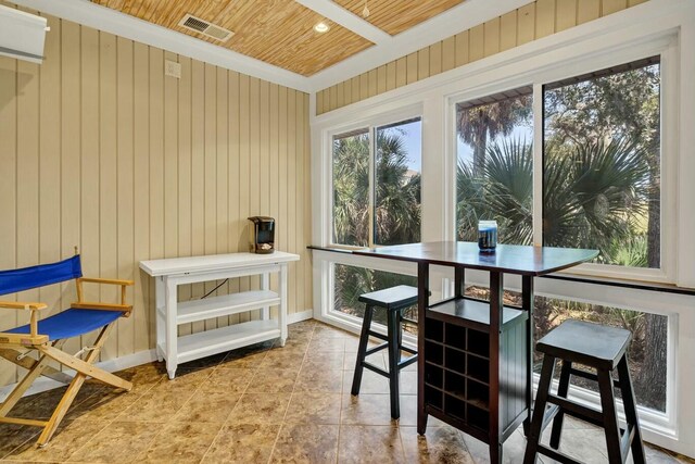 818 Club Cottage Ct, Edisto Beach, SC 29438 - tiled dining area featuring wood ceiling, wooden walls, and baseboards