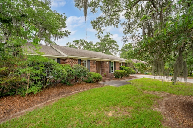 614 Beauregard St, Charleston, SC 29412 - ranch-style house with brick siding, a front lawn, driveway, crawl space, and roof with shingles