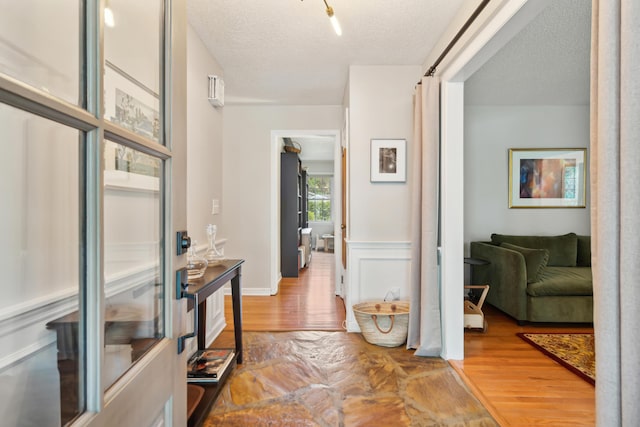 614 Beauregard St, Charleston, SC 29412 - corridor featuring wood finished floors and a textured ceiling