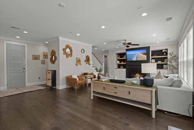 4019 Cascades Thrust, Summerville, SC 29483 - living area featuring a lit fireplace, crown molding, stairs, and visible vents