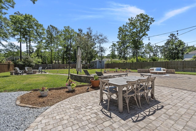 4019 Cascades Thrust, Summerville, SC 29483 - view of patio / terrace featuring a fenced backyard, outdoor dining area, a fire pit, and a storage shed