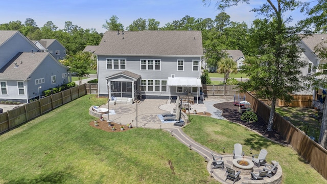 4019 Cascades Thrust, Summerville, SC 29483 - rear view of property featuring a patio area, a yard, a fenced backyard, an outdoor fire pit, and a sunroom