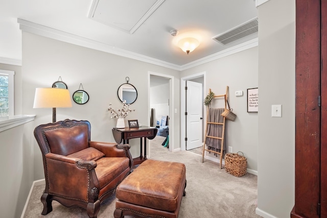 living area featuring attic access, visible vents, crown molding, baseboards, and carpet