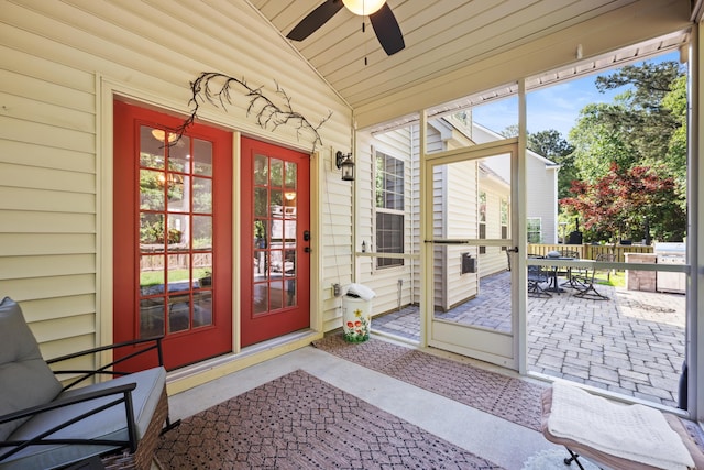 property entrance featuring a ceiling fan