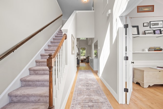 stairs with wood finished floors
