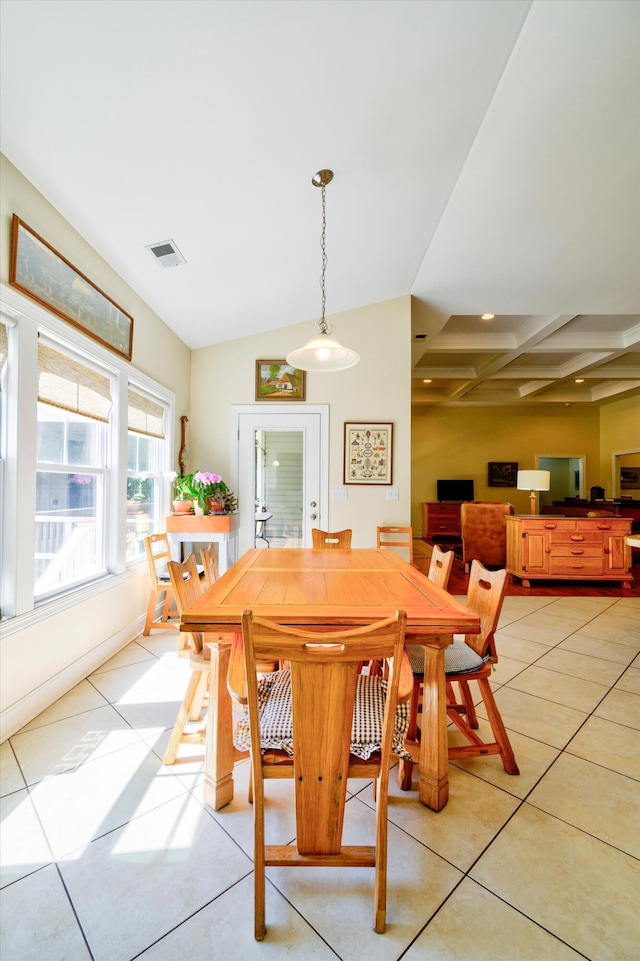 dining area with light tile patterned flooring, lofted ceiling, and visible vents