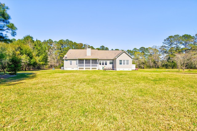 exterior space with a sunroom, crawl space, and a yard