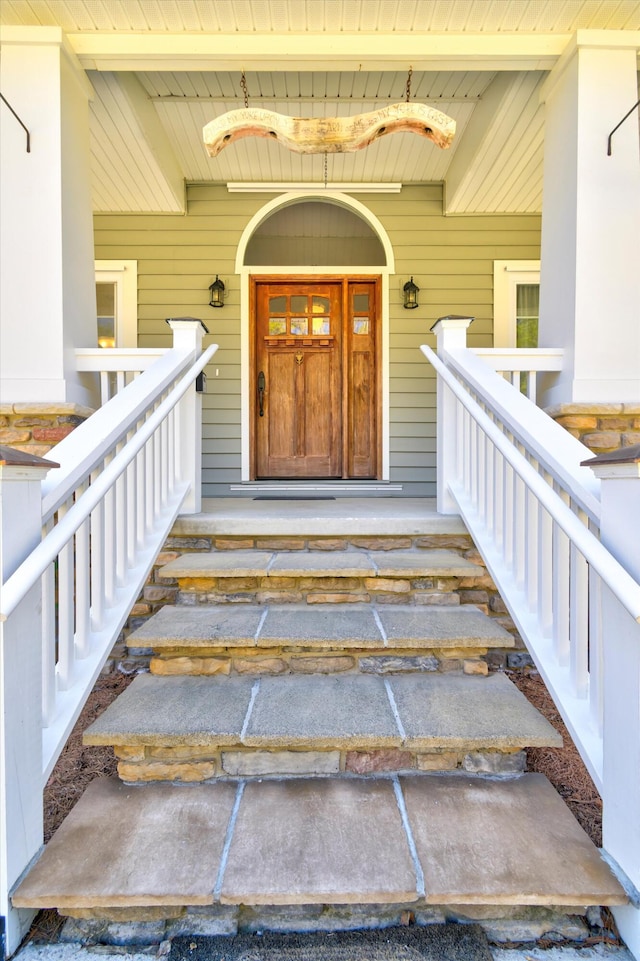 doorway to property featuring covered porch