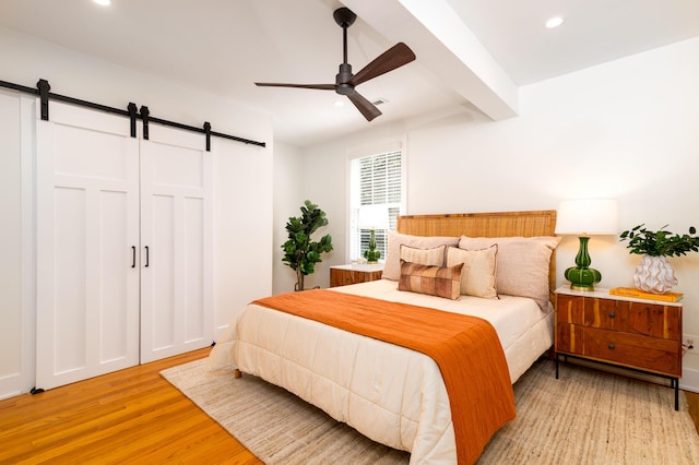31 Lyttleton Ave, Charleston, SC 29407 - bedroom featuring a barn door, light wood-style flooring, recessed lighting, ceiling fan, and beam ceiling