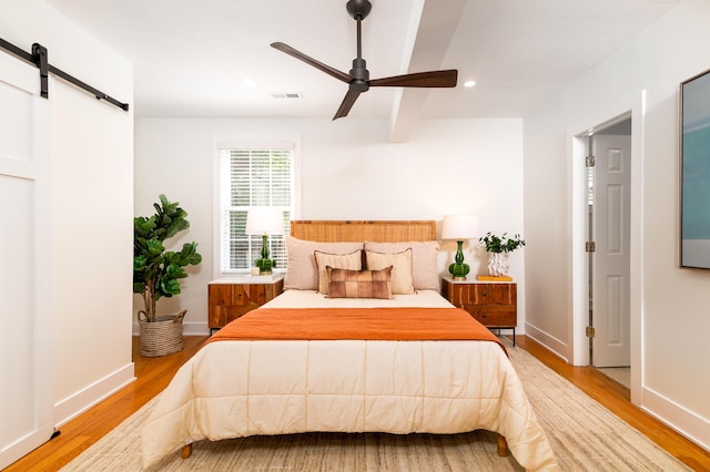 31 Lyttleton Ave, Charleston, SC 29407 - bedroom featuring wood finished floors, a barn door, recessed lighting, and a ceiling fan