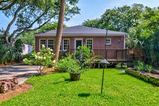 31 Lyttleton Ave, Charleston, SC 29407 - back of property featuring a shingled roof, brick siding, and a wooden deck